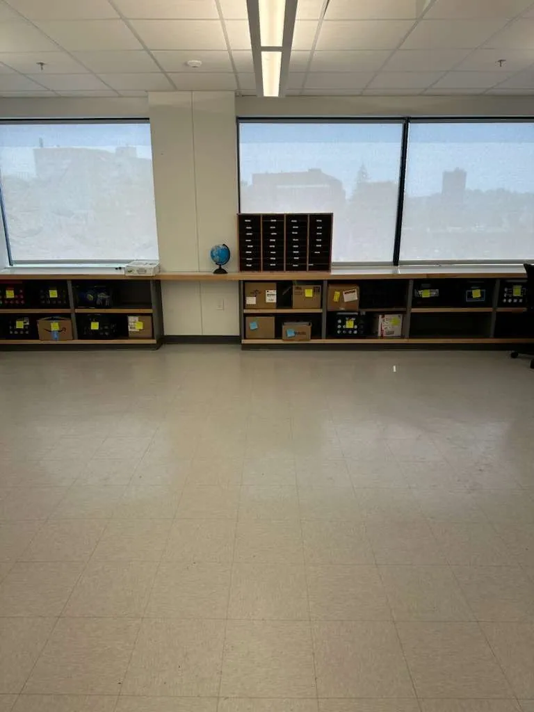 Clean tile floor in a bright classroom with windows